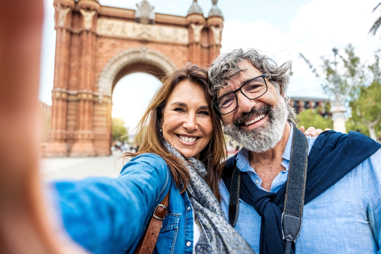 Stress-free retired couple taking a selfie during travels