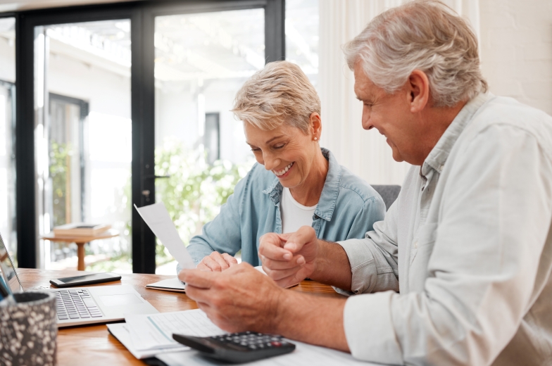 Mature couple reviewing their finances and analyzing the effects of inflation in retirement